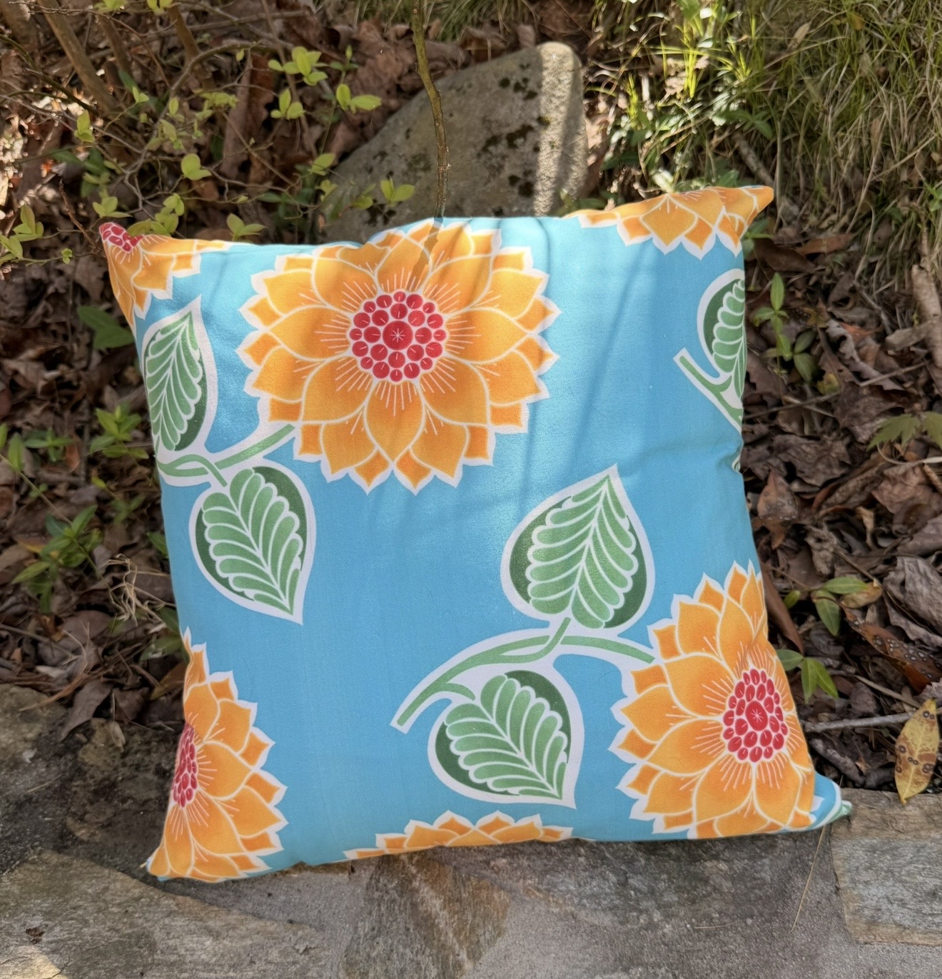 Pillow with flowers and leaves